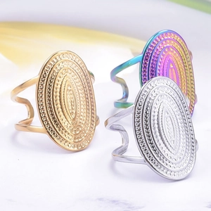 Three-piece set of adjustable stainless steel rings in gold, silver, and rainbow colors