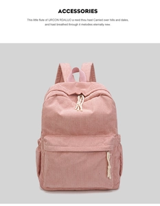 Detailed view of pink corduroy backpack featuring knotted zippers and adjustable shoulder straps