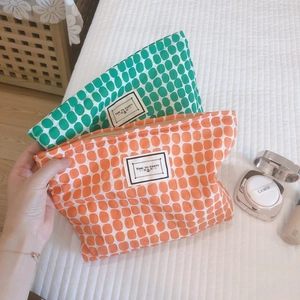 Fashionable geometric cotton pouches in orange and green with Time to Party labels