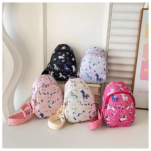 Detailed row of five colorful kids cartoon unicorn chest bags in nylon fabric