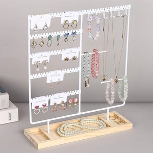 Metal jewelry organizer with wood base for hanging earrings and necklaces neatly