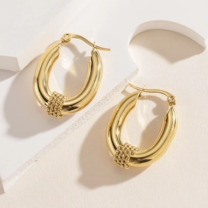 Irregular 14K gold plated stainless steel hoop earrings with woven texture on white stand