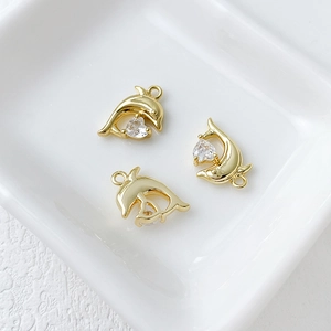 Three 14k gold-plated dolphin charms with heart cubic zirconia stones for DIY jewelry