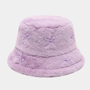 Plush lavender faux fur bucket hat featuring sweet satin ribbon bows for winter warmth