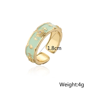 Detail of 18K gold-plated crown ring with green enamel, zircon heart and 4g weight