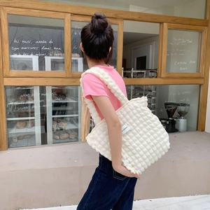 Quilted bubble texture canvas tote bag in creamy white with wide shoulder strap details