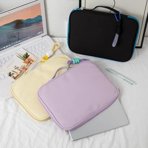 Waterproof laptop sleeve case for iPad and 14-inch notebooks in yellow, purple, and black