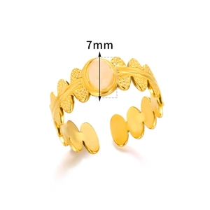 Detail of 18K gold plated vintage flower ring with 7mm pink stone and leaf textured band