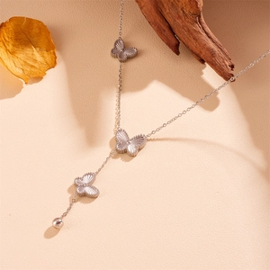 Silver Y-necklace with guilloche butterfly pendants and polished steel bead accent