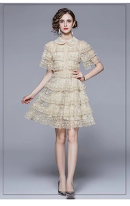 Detail of ruffle lace stitching and multi-layer cake skirt on beige French dress
