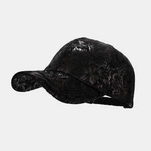Detailed side view of black baseball cap with 3D floral texture and glossy PU finish