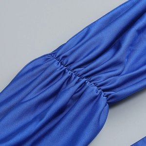 Close-up of royal blue pleated fabric with detailed ruched texture and elastic seams