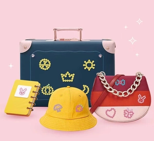 Kids DIY hair gem machine toy set with a retro suitcase, sun hat, and crossbody bag