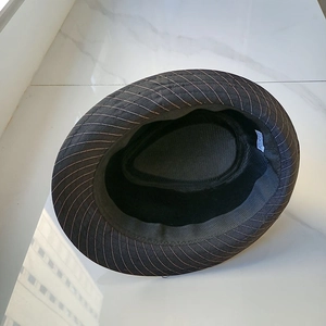 Classic black pinstripe jazz hat with soft lining and detailed interior tag