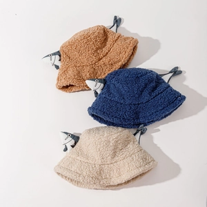 Cute lamb wool bucket hats in brown, navy, and cream with cartoon fish decor and wind strings