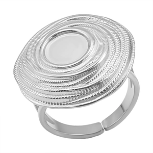 Detail of adjustable silver steel ring featuring round geometric layers and white inlay