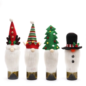 Set of 4 creative gnome Christmas wine bottle covers with reindeer and snowman designs