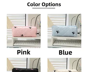 Quilted floral pencil case set in pink, blue, black, and white showing various colors