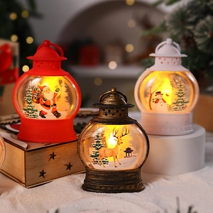 Set di tre lanterne LED natalizie con Babbo Natale, pupazzo di neve e decori renna