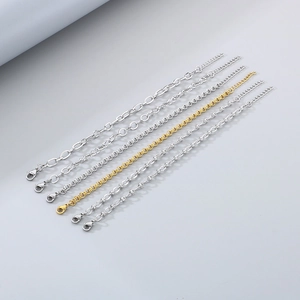 Assorted gold and silver stainless steel link chains in various minimalist designs