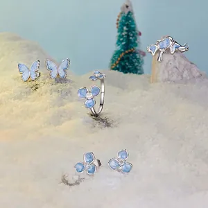 Winter jewelry set with snowflake flower and blue butterfly earrings and 925 silver ring