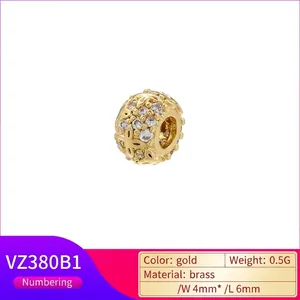 Golden flower engraved charm bead in brass with white zircon stone, size 4x6mm
