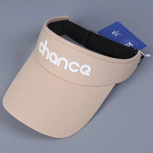 Detailed close-up of beige sun visor showing vertical texture and UPF 50+ hangtag