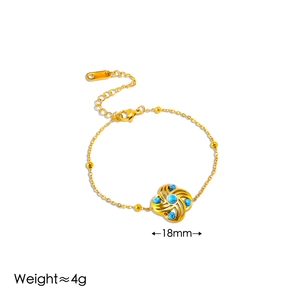 Detail of windmill flower bracelet with turquoise stone inlays, 18mm pendant size