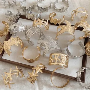Adjustable ocean themed starfish and seashell metal cuff bracelets in gold and silver