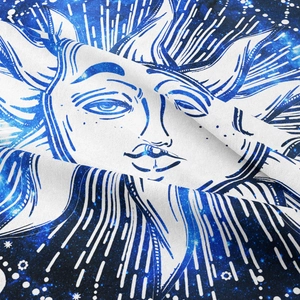Close-up of Bohemian sun tapestry fabric showing detailed weave and celestial pattern