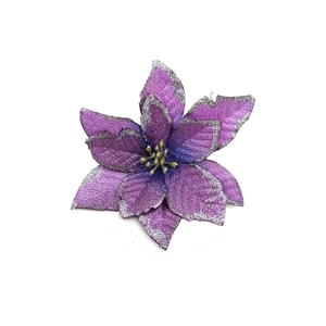 Detailed view of a purple artificial Christmas flower with silver glitter edges