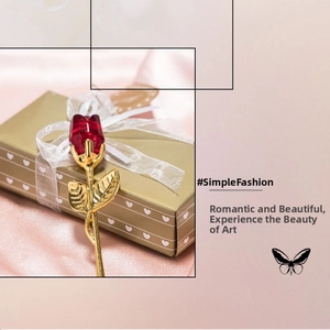 Detailed view of a crystal rose gift with golden metal stem in a heart-shaped box