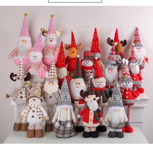 Group of telescopic Christmas dolls including Santa, reindeer and snowman on display
