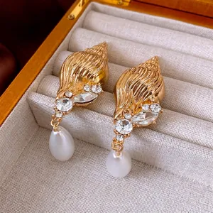 Vintage conch shell drop earrings with gold plating, sparkling rhinestones and teardrop pearls