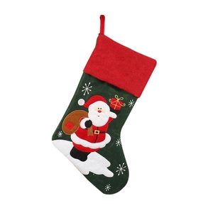 Green Christmas stocking with red cuff and Santa Claus embroidery for holiday candy gifts