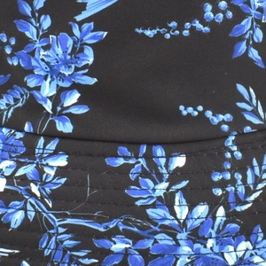 Macro detail of bucket hat brim with blue floral prints and parallel stitching lines