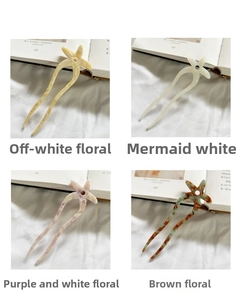 U-shaped hair pins in four colors featuring starfish designs with floral textures