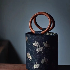 Detail of vintage Tang horse embroidery on silk bucket bag with round wooden handle