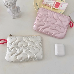 Quilted heart cosmetic pouch in pink and silver with pearl chain handle detail