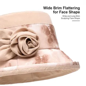Cappello da sole beige da donna con fiore e tesa larga per protezione UV