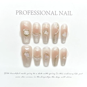 Handmade light pink to silver glitter gradient coffin nails with pearl and shell accents