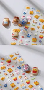 Macro view of 3D embossed nail stickers featuring picnic bears and fast food motifs