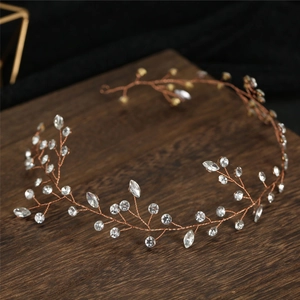 Detailed view of handmade rose gold bridal headband with crystal vine and rhinestones