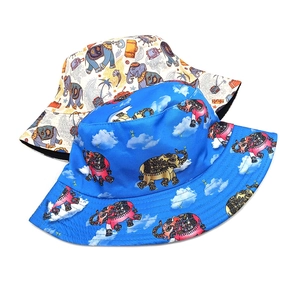 Detail of elephant pattern and blue sky cloud print on breathable cotton bucket hats