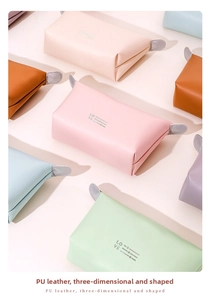 Collection of colorful PU leather makeup bags in pink, mint, blue and orange with LOVE print