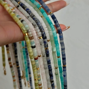 Handmade natural stone beaded necklace with colorful round beads and gold spacers
