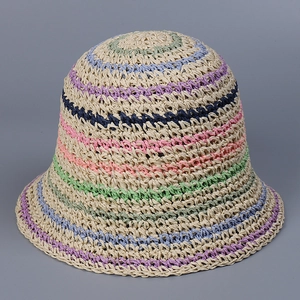 Detailed texture of handcrafted crochet straw bucket hat with colorful stripes