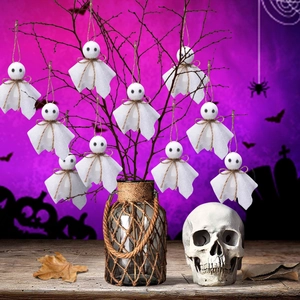 Ghost hanging decorations with black eyes and flowing bodies for Halloween party decor