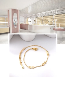 Detail of gold stainless steel infinity link bracelet with adjustable chain and clasp