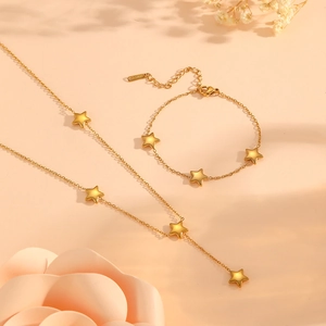 Golden star pendant necklace and bracelet set in polished 18k plated stainless steel